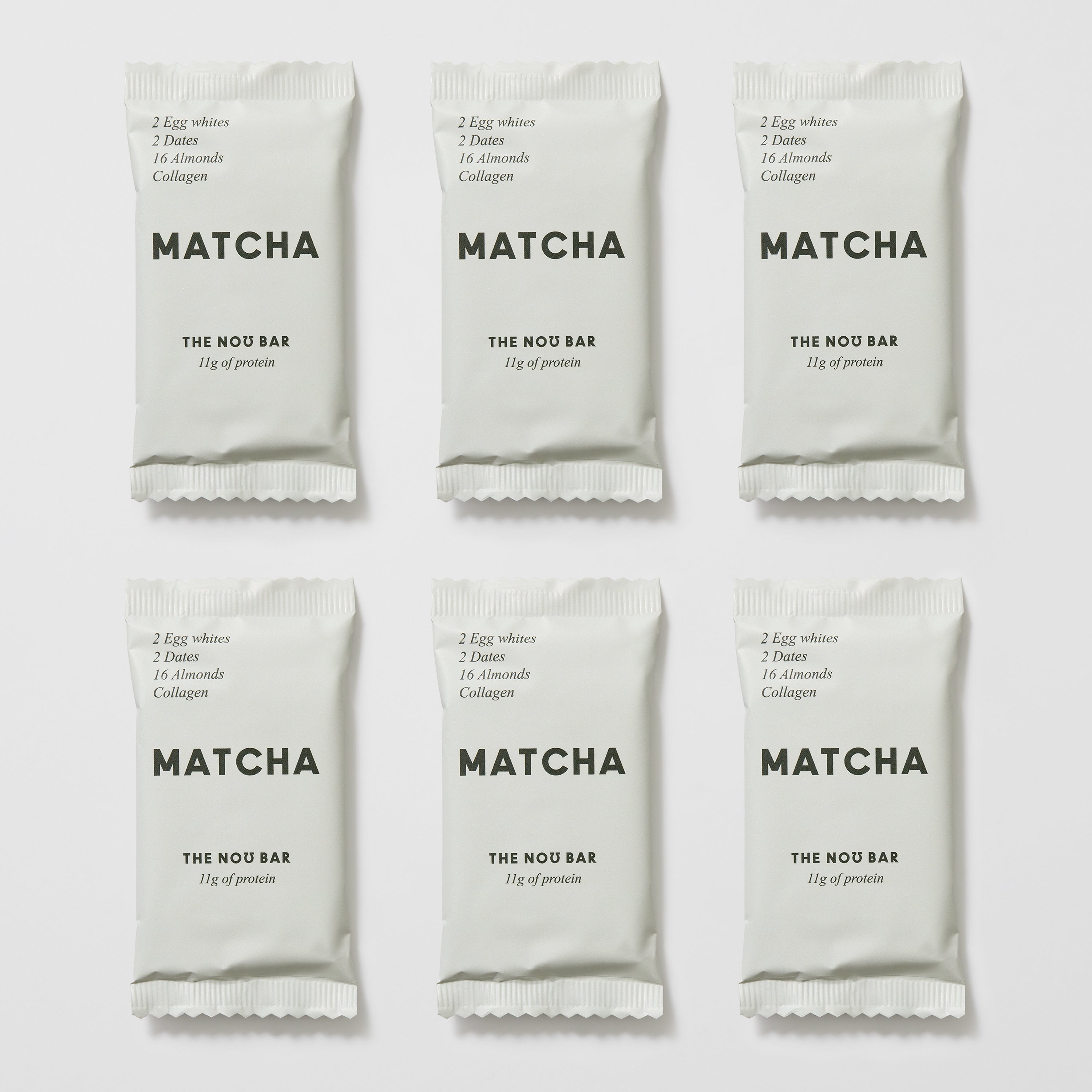 A collection of MATCHA flavored nutrition bars packaged in white, labeled as 'THE NO BAR' with matcha being the prominent flavor.
